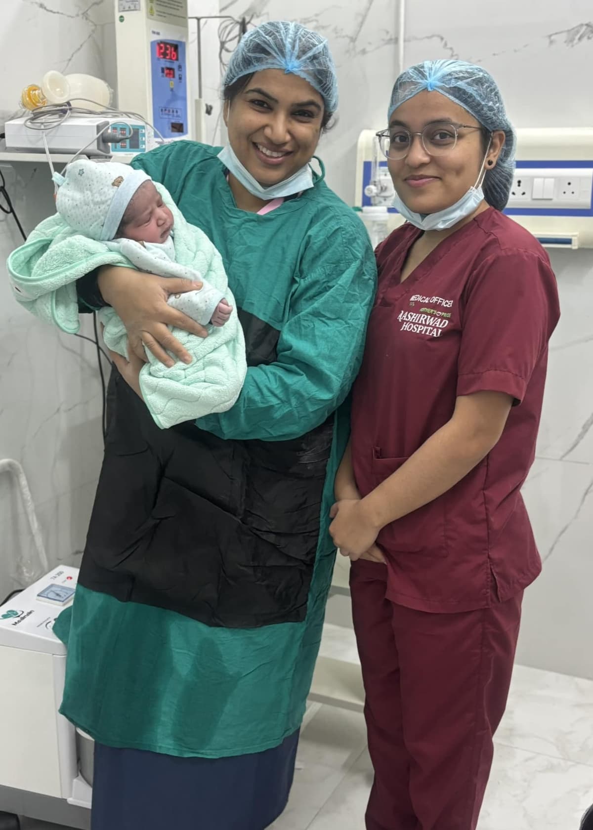 Dr. Ratika Jindal and staff with a newborn at Aashirwad Hospital